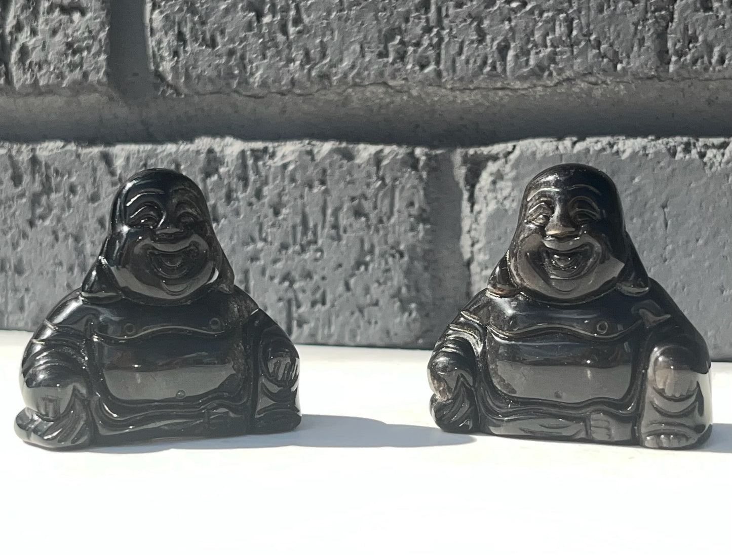 Silver Obsidian Buddha Carvings